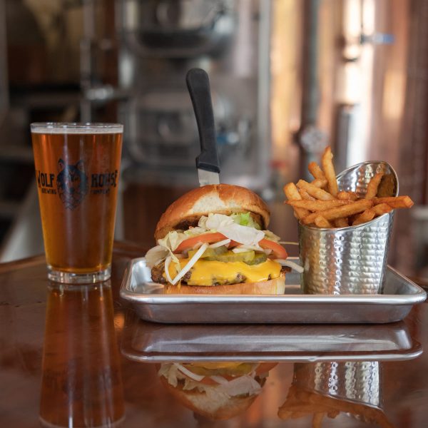beer, burger, and fries in a brewery