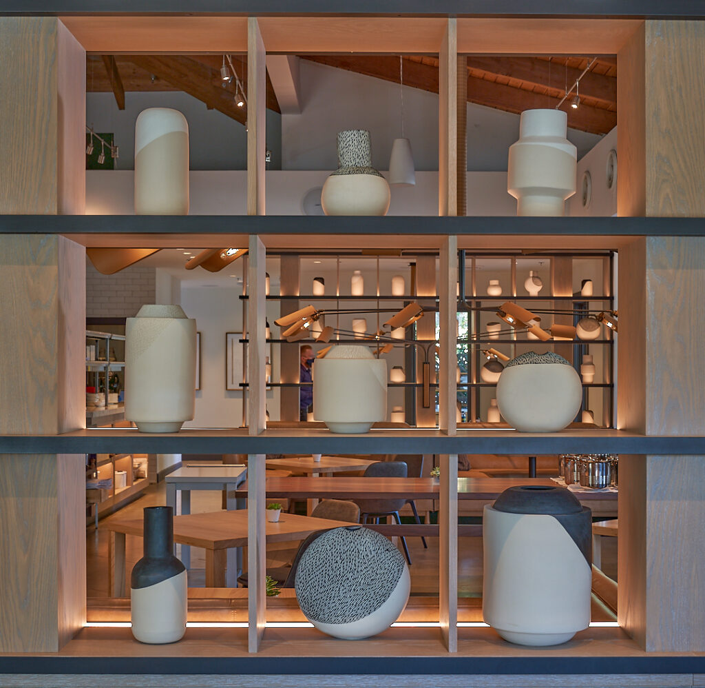 ceramic vases displayed in a window
