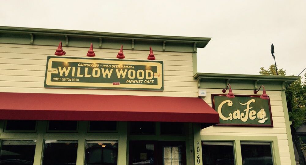 Willow Wood Market and Cafe exterior with front windows and red awning.