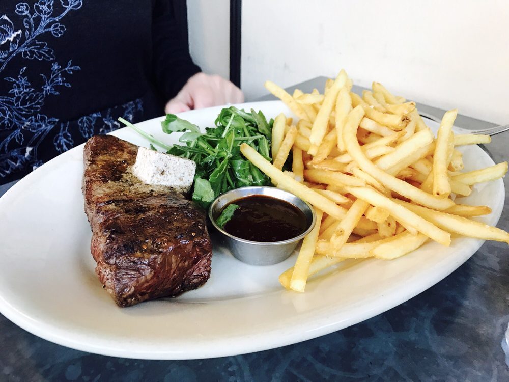 Underwood Bar and Bistro steak frites with dipping sauce and salad.