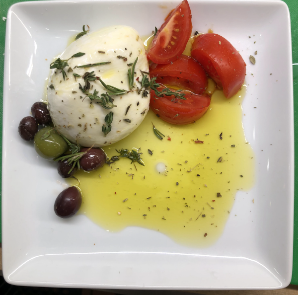Portico burrata, olive oil, tomatoes, and olives with seasoning