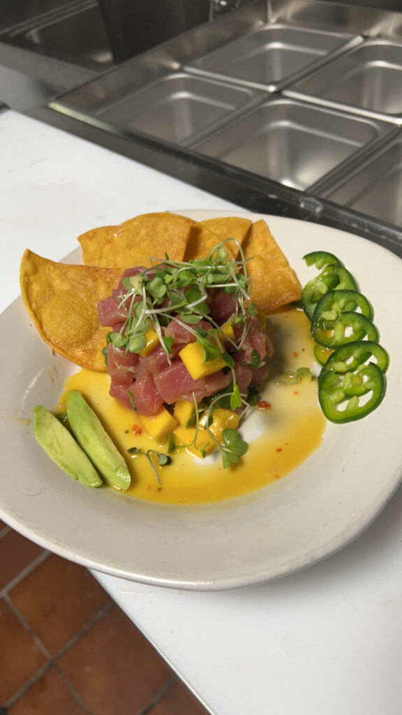 Eddie's Kitchen poke with mango, pepper, avocado, and chips